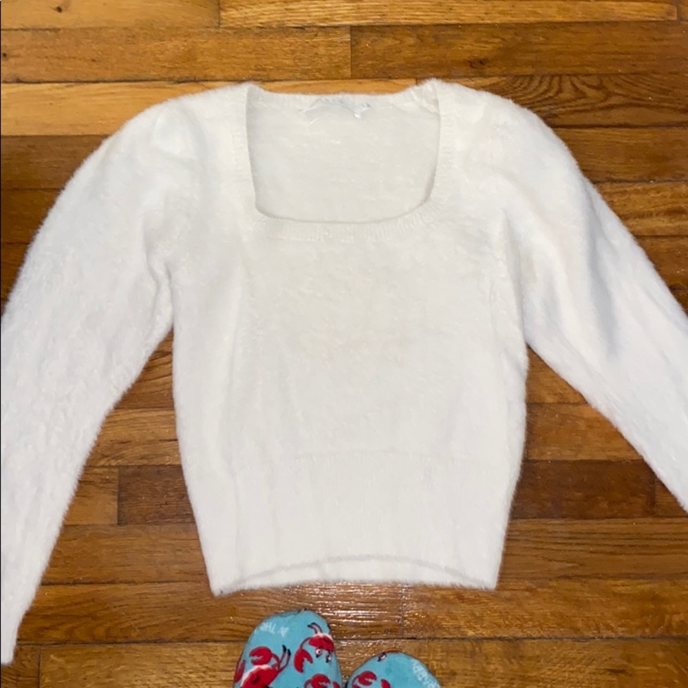 A white fuzzy sweater